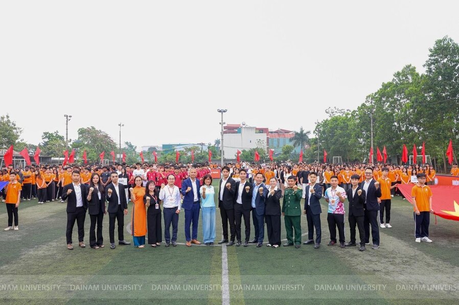 A group of people standing on a field

Description automatically generated